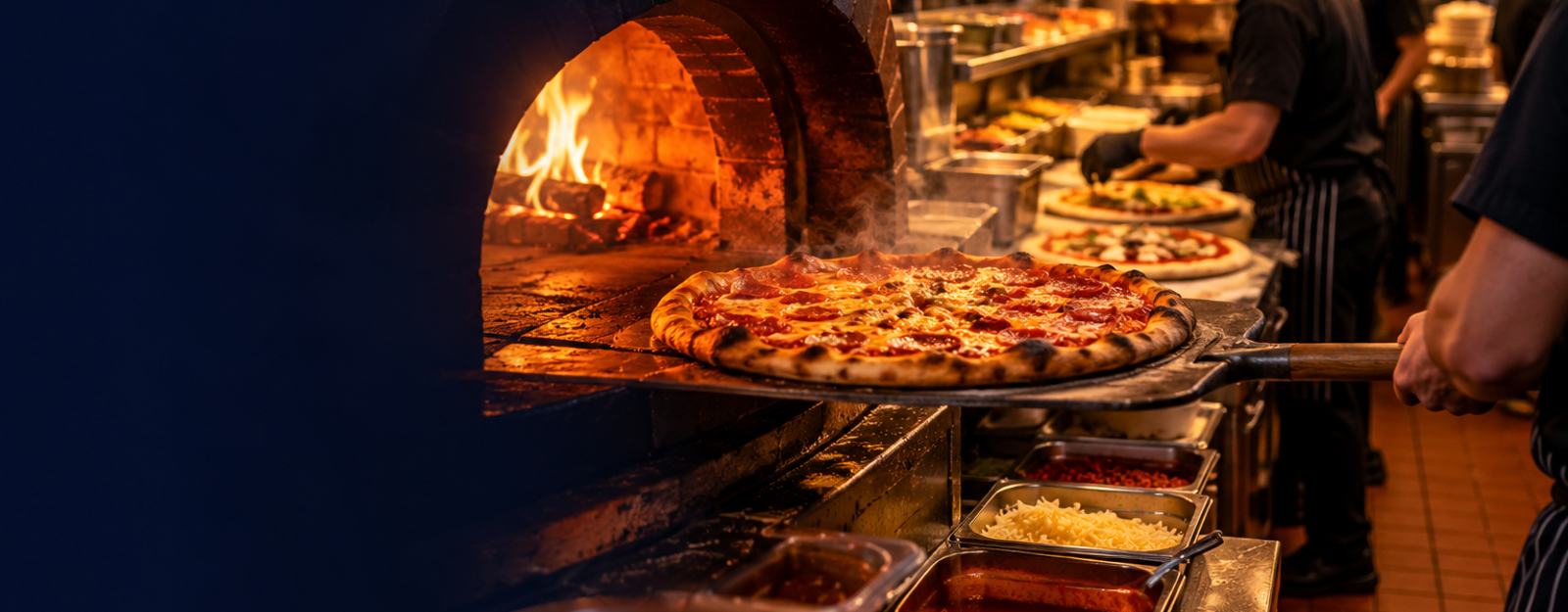 Busy pizza kitchen during the evening rush
